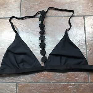 Black bralette with flowers going from neck down